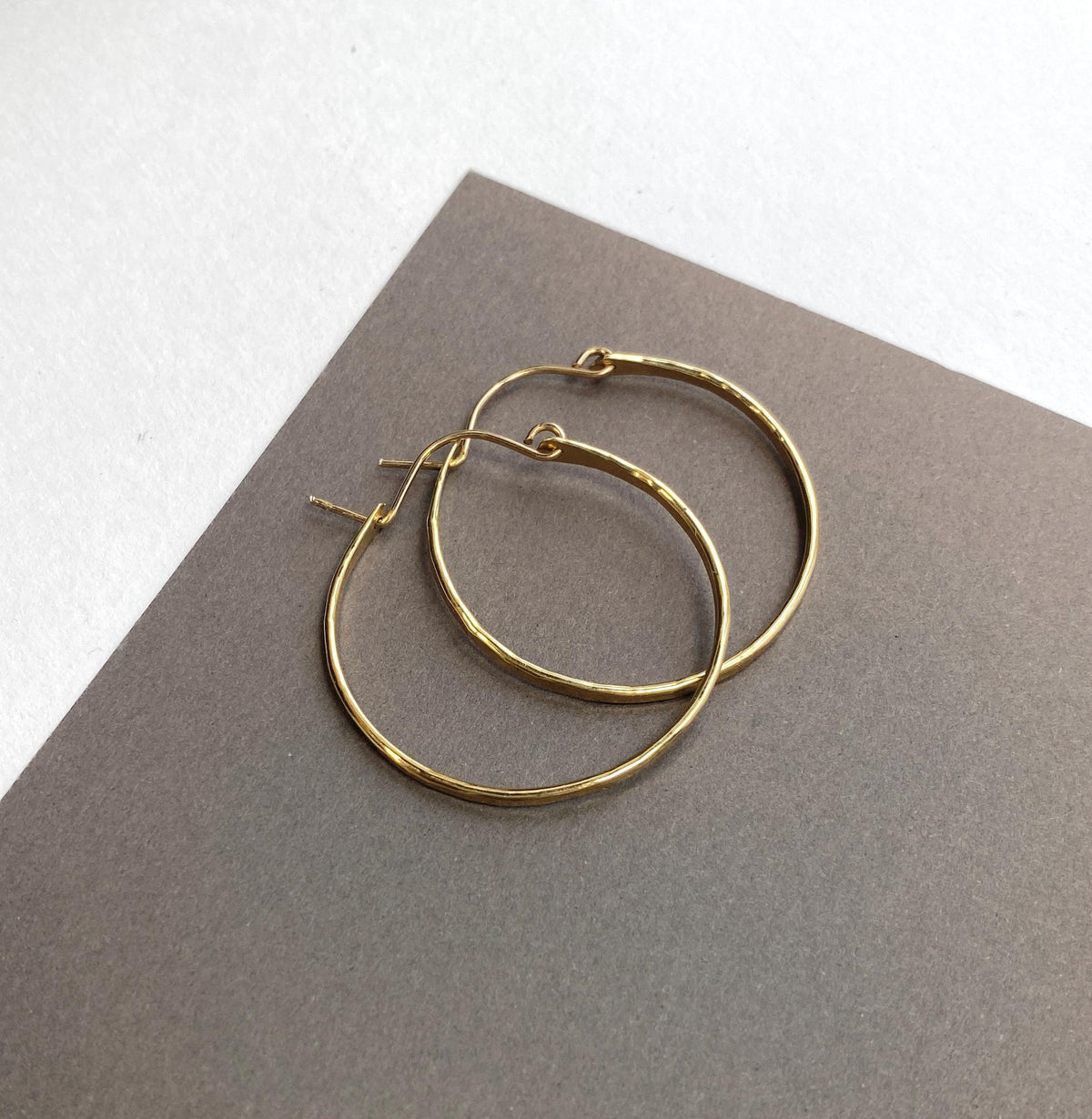 Flat front hammered medium gold hoop earrings